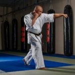 Karate fighter practicing martial arts in a fight club