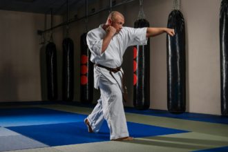 Karate fighter practicing martial arts in a fight club