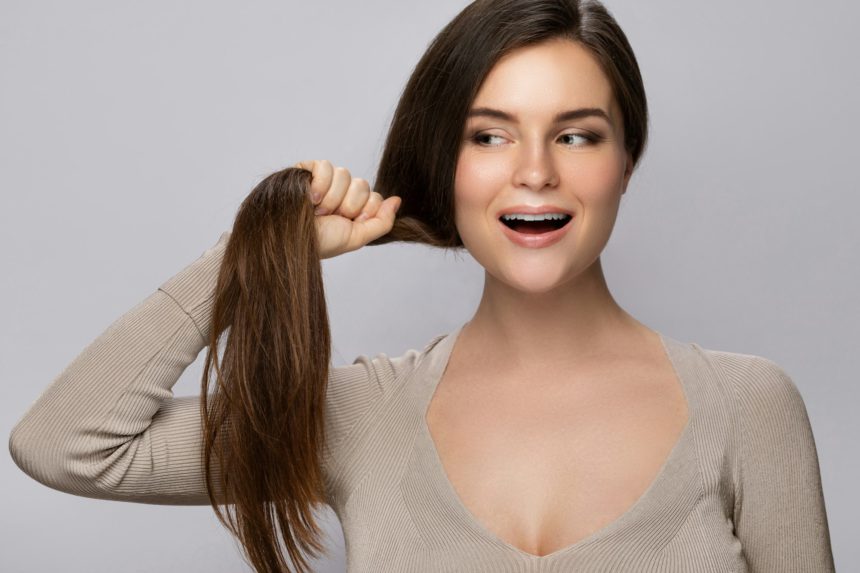 Woman is happy with her beautiful and healthy hair